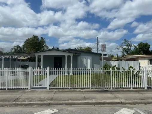 a view of a house with a small yard