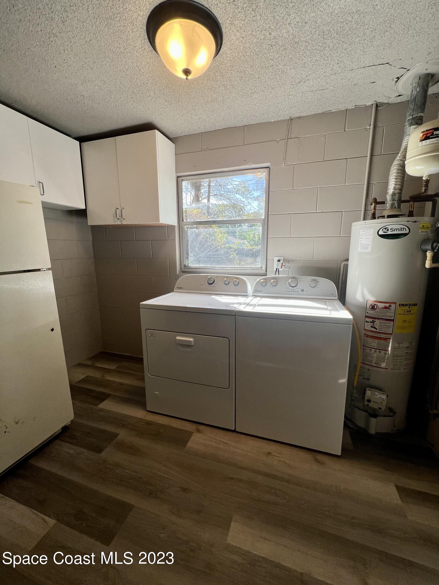1095 Coronado Drive Rockledge, FL 32955 - Photo 12 of 28 a utility room with dryer and washer