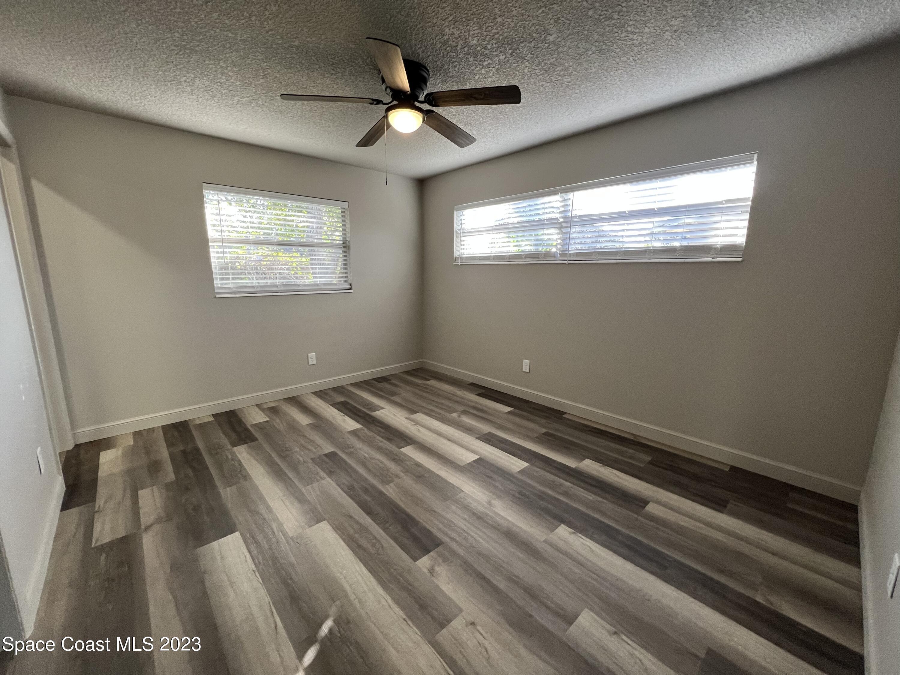 1095 Coronado Drive Rockledge, FL 32955 - Photo 22 of 28 a view of a room with a ceiling fan