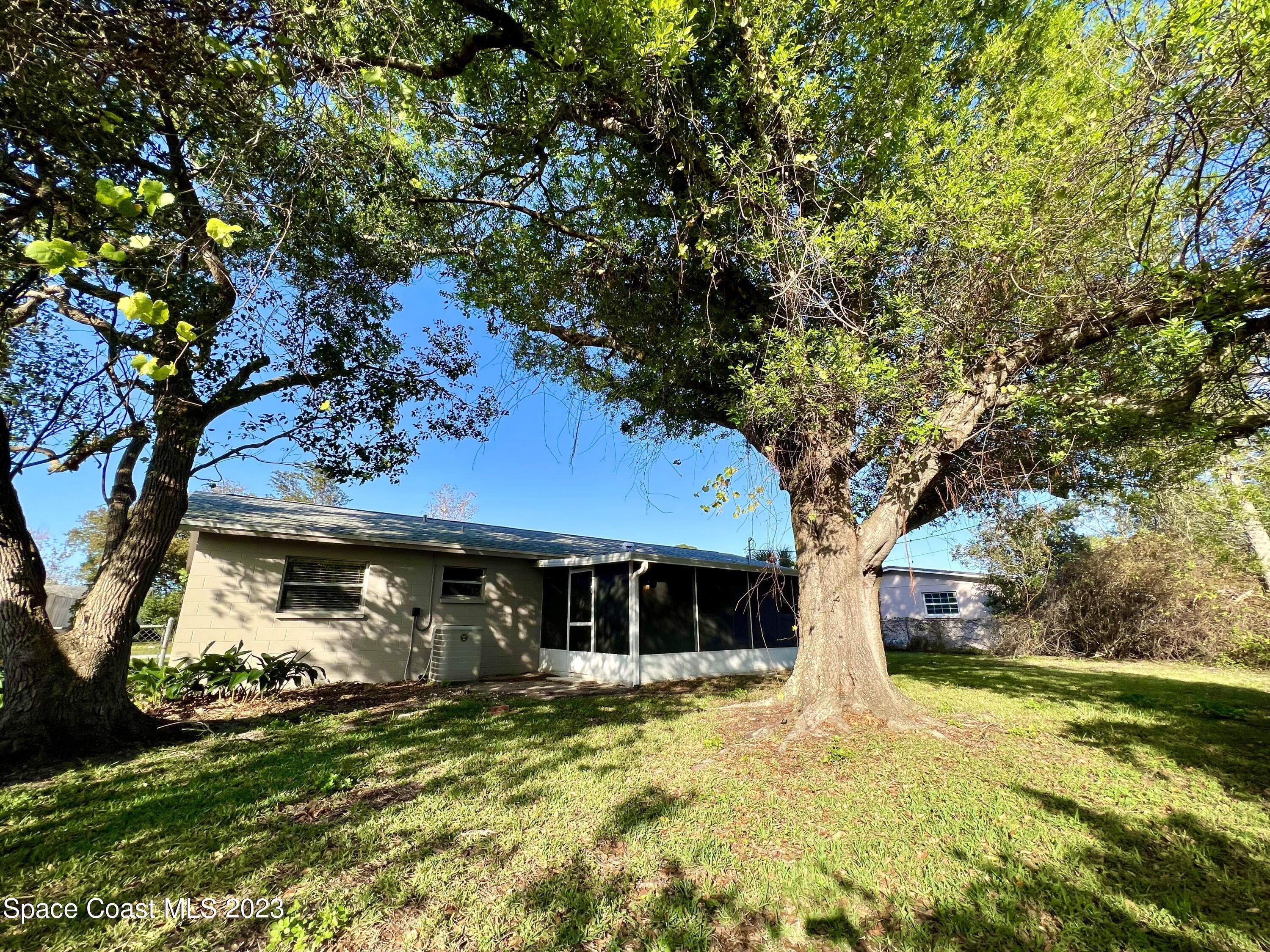 1095 Coronado Drive Rockledge, FL 32955 - Photo 28 of 28 a front view of a house with garden
