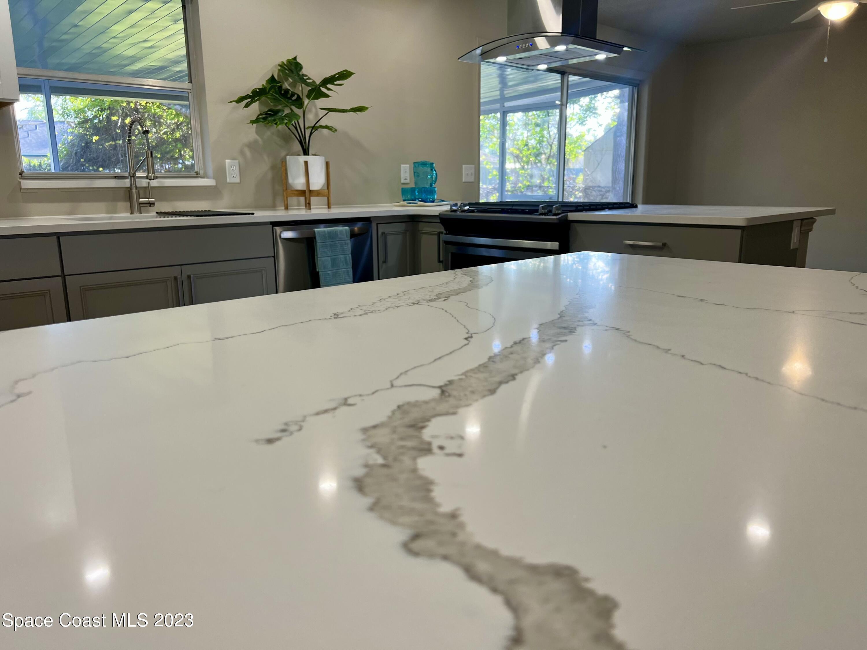 1095 Coronado Drive Rockledge, FL 32955 - Photo 8 of 28 a view of a living room with a large window