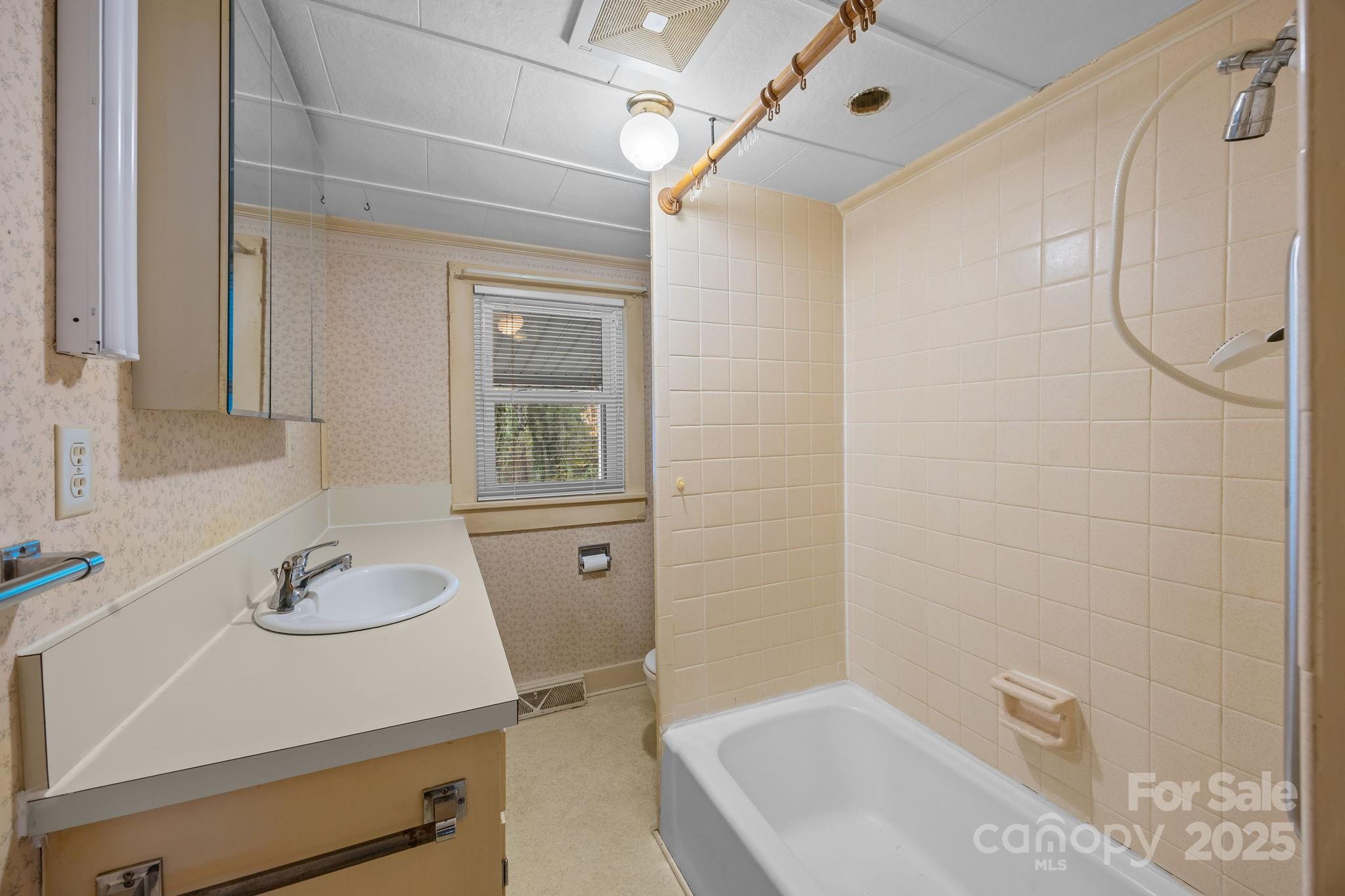 3020 Old Union Church Road Salisbury, NC 28146 - Photo 21 of 48 a bathroom with a tub sink and mirror
