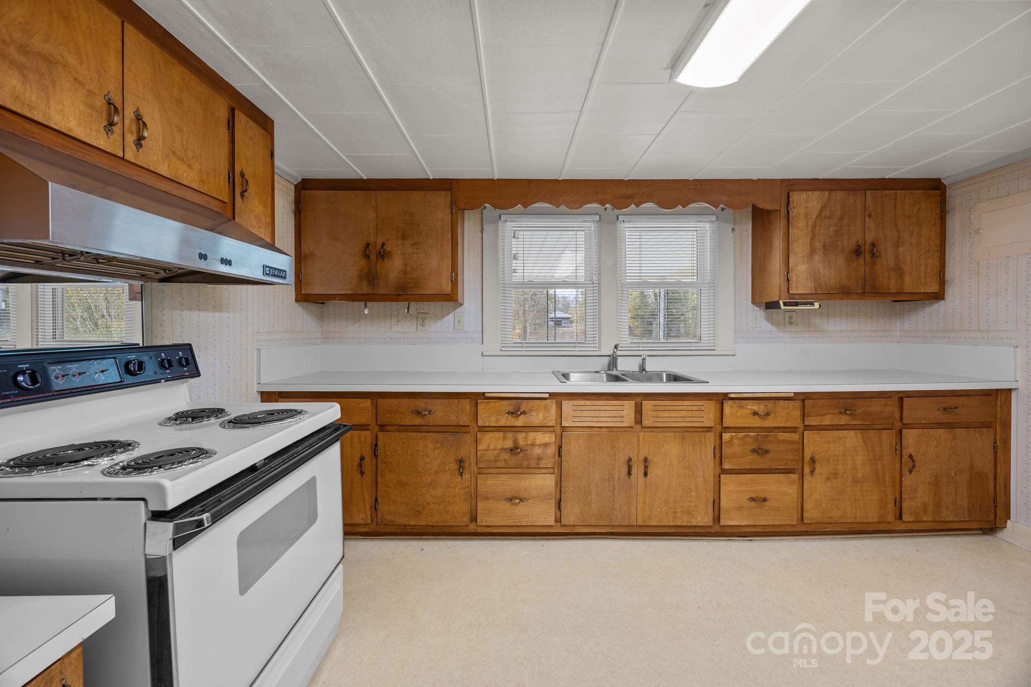 3020 Old Union Church Road Salisbury, NC 28146 - Photo 27 of 48 a kitchen with granite countertop a sink cabinets stainless steel appliances and a counter space