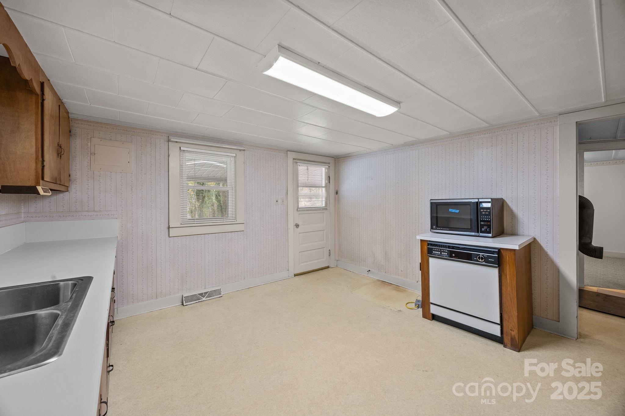 3020 Old Union Church Road Salisbury, NC 28146 - Photo 28 of 48 a kitchen with a stove and a refrigerator