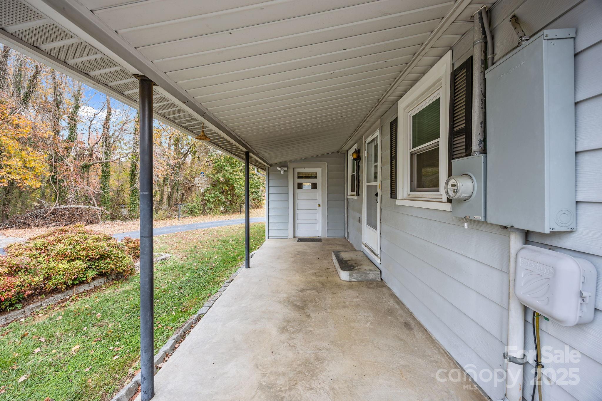 3020 Old Union Church Road Salisbury, NC 28146 - Photo 31 of 48 a view of a porch with a floor to ceiling window and wooden fence
