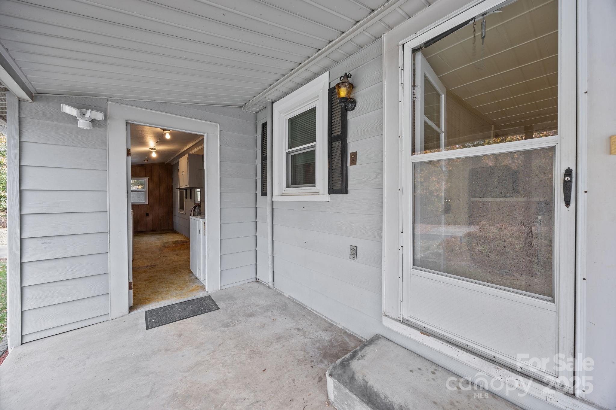 3020 Old Union Church Road Salisbury, NC 28146 - Photo 32 of 48 a view of a hallway with a glass door and a window