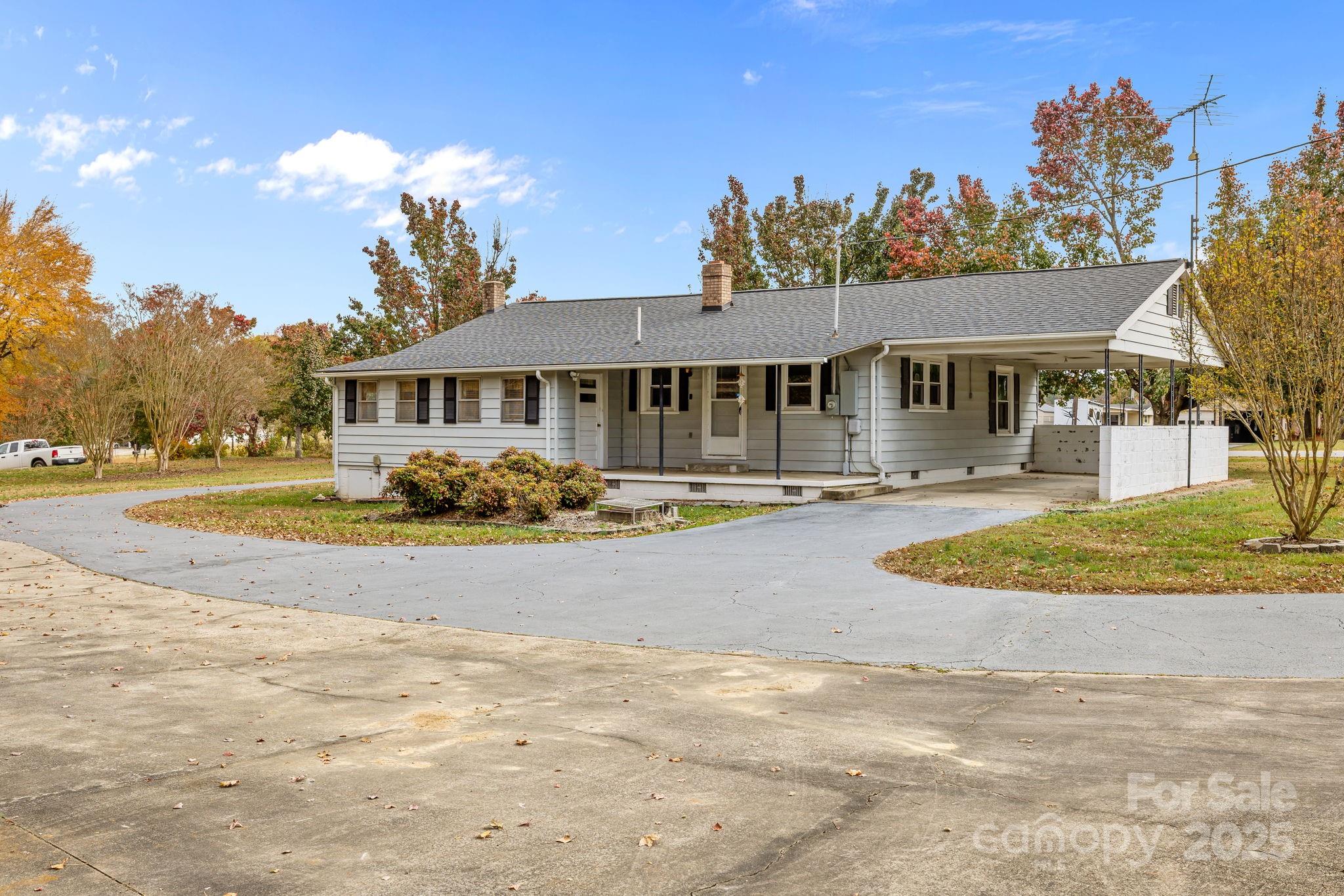 3020 Old Union Church Road Salisbury, NC 28146 - Photo 36 of 48 a front view of a house with a yard and trees