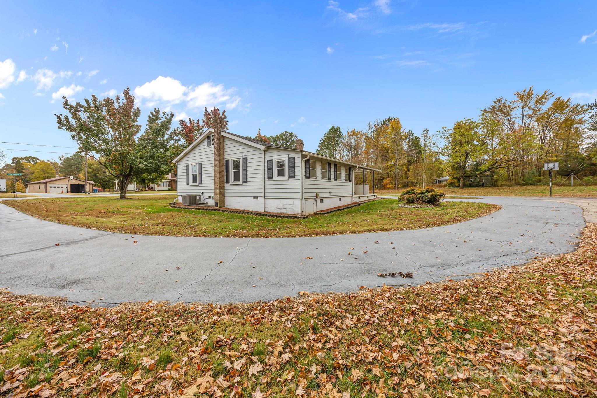 3020 Old Union Church Road Salisbury, NC 28146 - Photo 37 of 48 a view of a house with a big yard and large trees