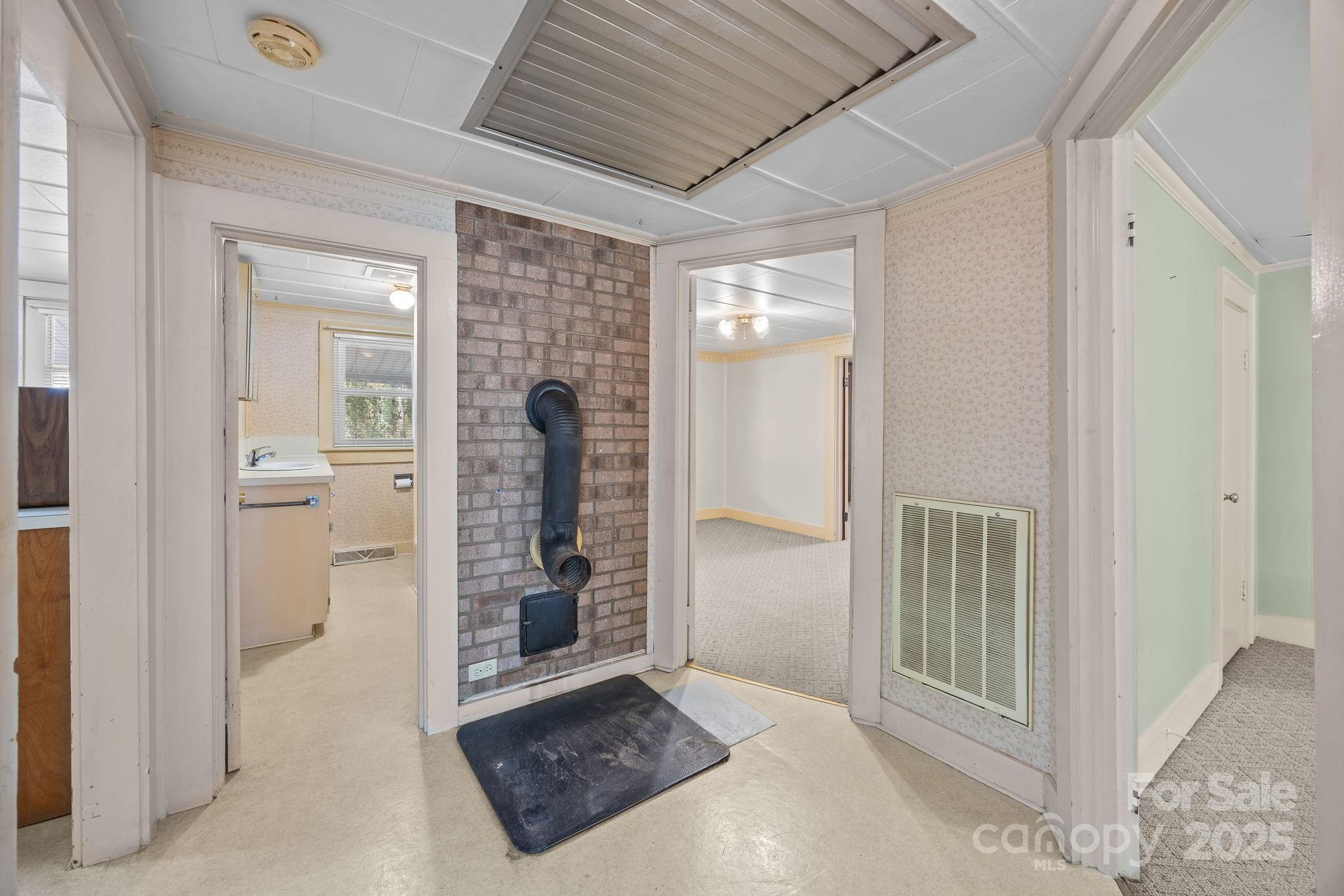 3020 Old Union Church Road Salisbury, NC 28146 - Photo 10 of 48 a view of a hallway with a livingroom and a chandelier