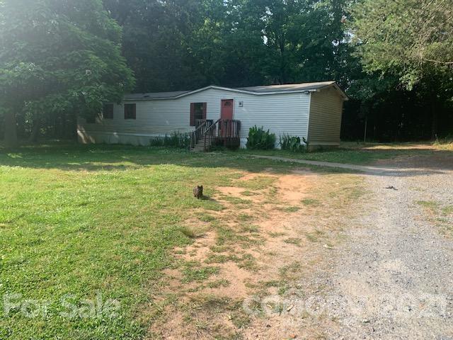 1220 Woodridge Road, Unit 5 Clover, SC 29710 - Photo 2 of 9 a view of a house with a yard