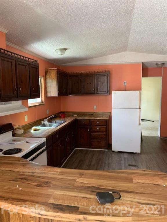 1220 Woodridge Road, Unit 5 Clover, SC 29710 - Photo 3 of 9 a kitchen with stainless steel appliances granite countertop a refrigerator and a stove top oven