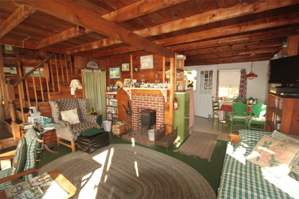 269 Shore Road Boothbay, ME 04544 - Photo 5 of 18 The living room with painted wood...