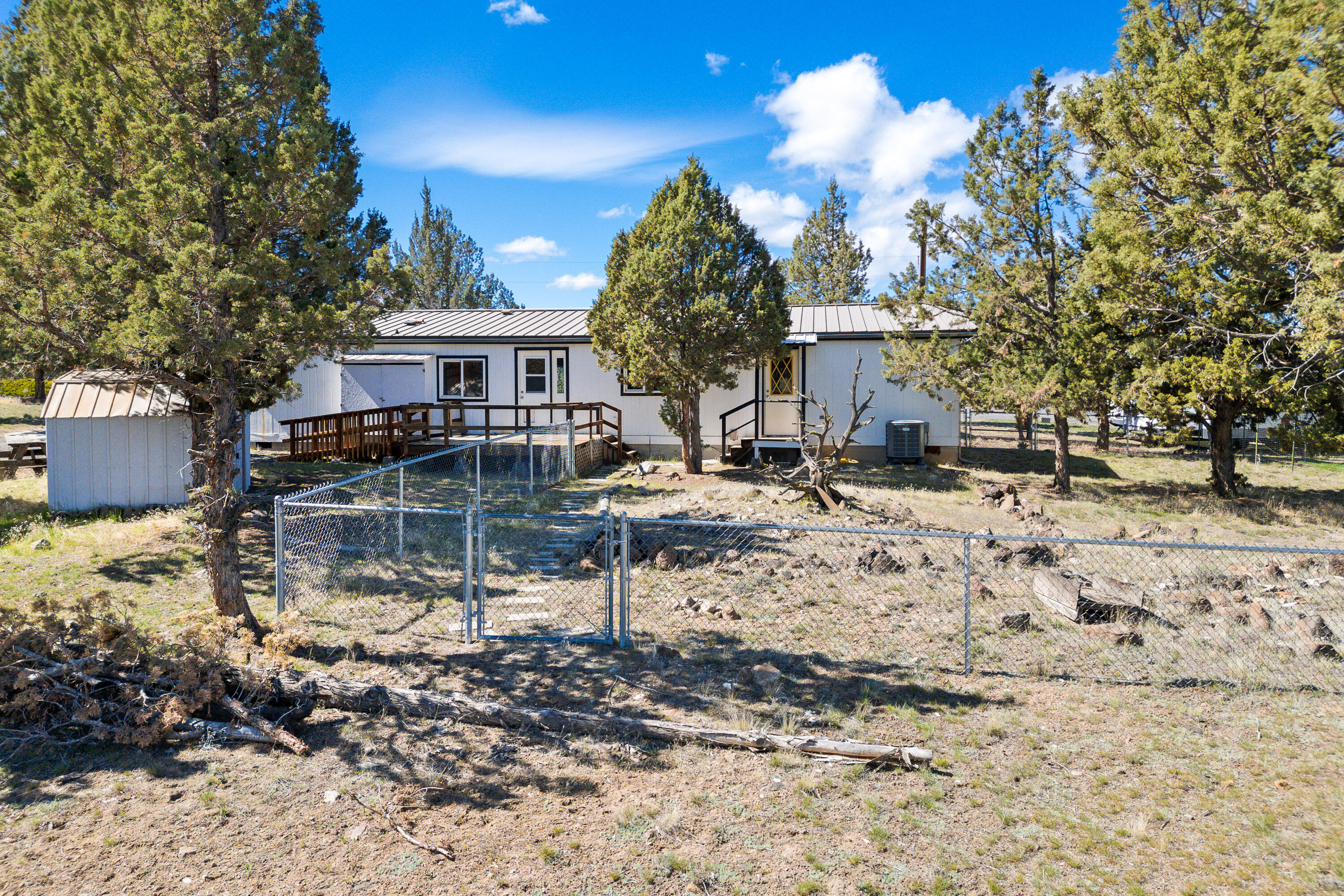 5674 Southeast Davis Loop Prineville, OR 97754 - Photo 33 of 48 a view of a house with a yard covered in snow