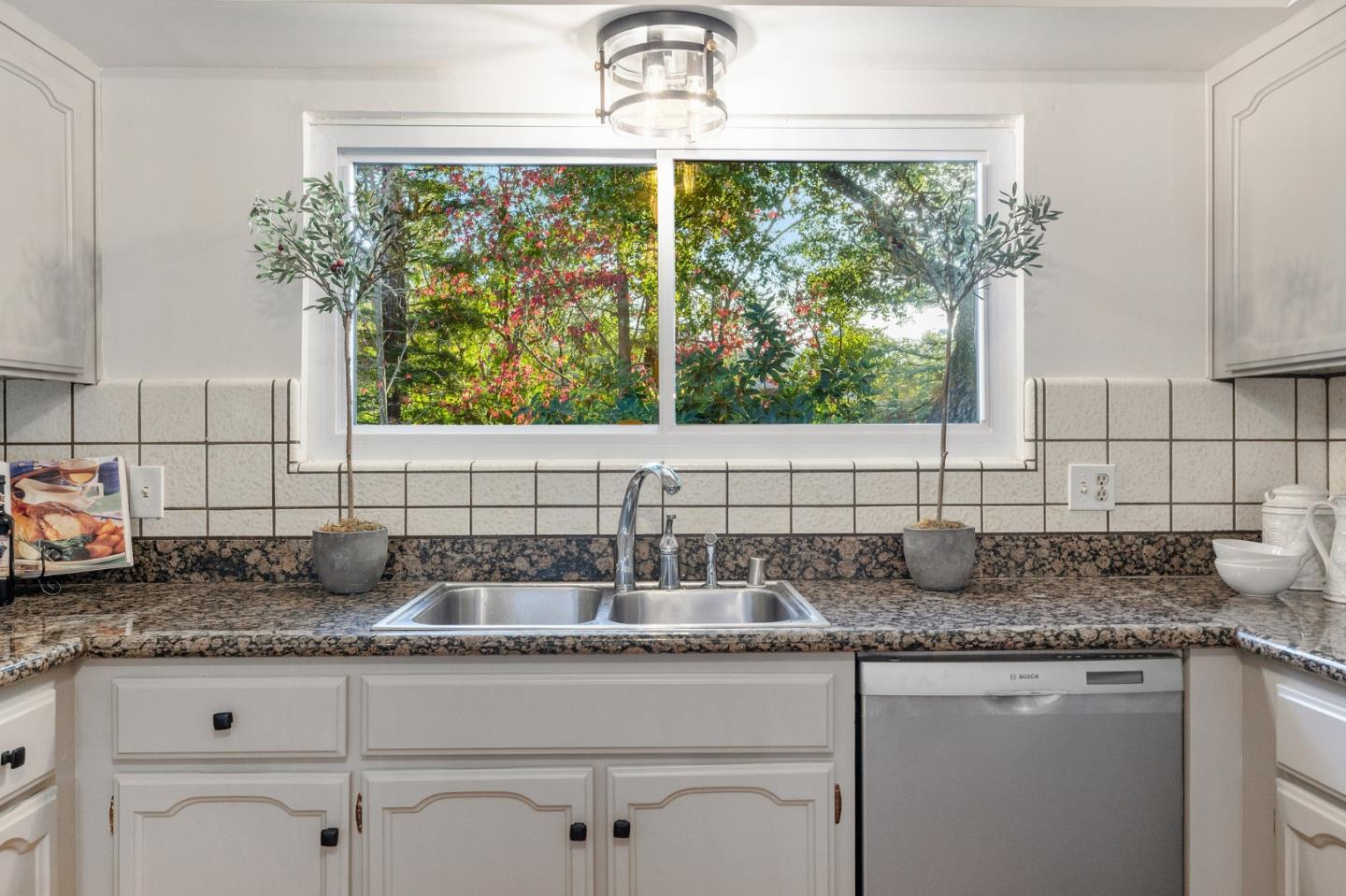 16 Valley Road Atherton, CA 94027 - Photo 29 of 100 a kitchen with granite countertop a sink and a white wooden cabinets