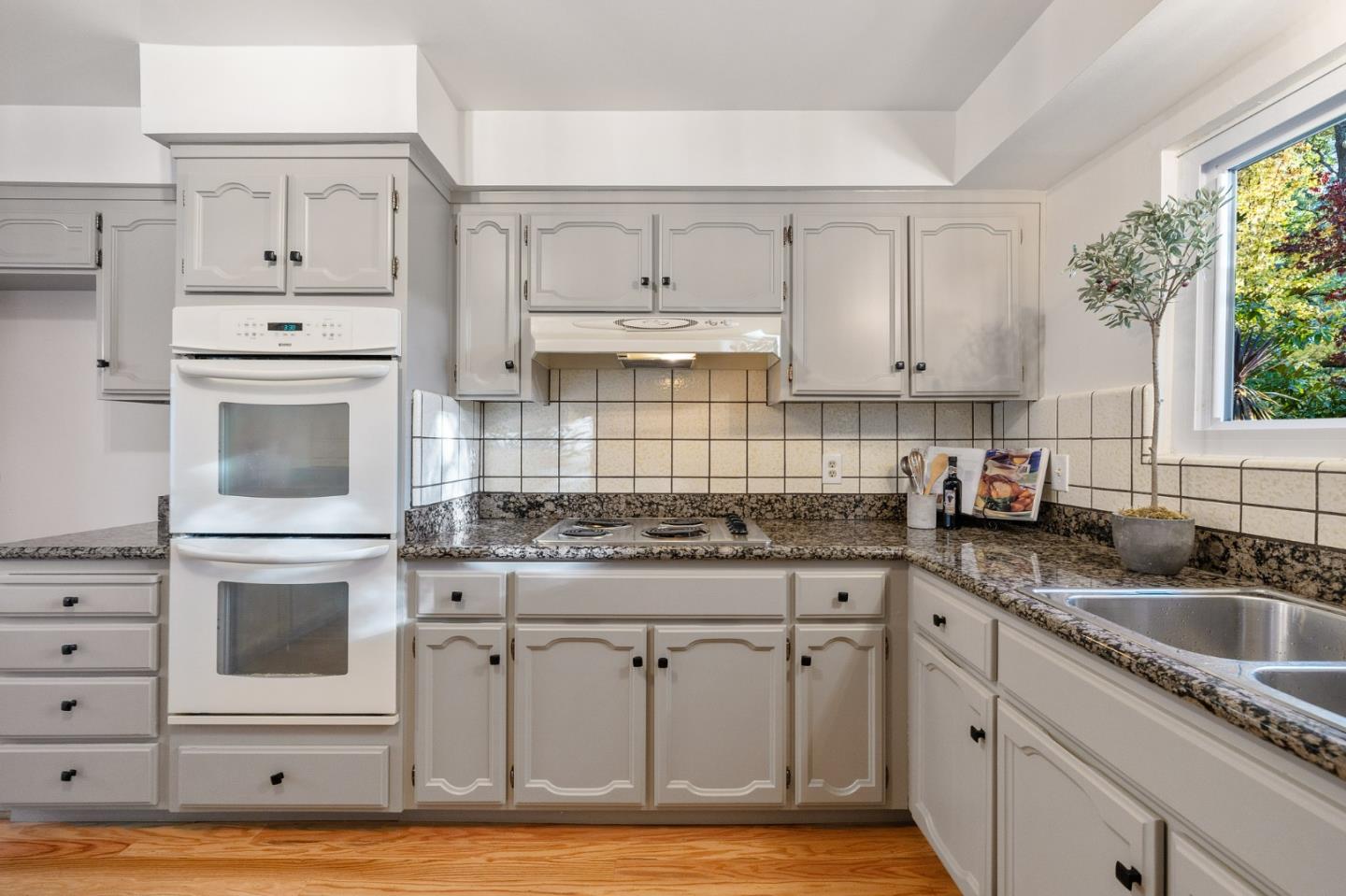 16 Valley Road Atherton, CA 94027 - Photo 30 of 100 a kitchen with granite countertop cabinets stainless steel appliances and a counter space