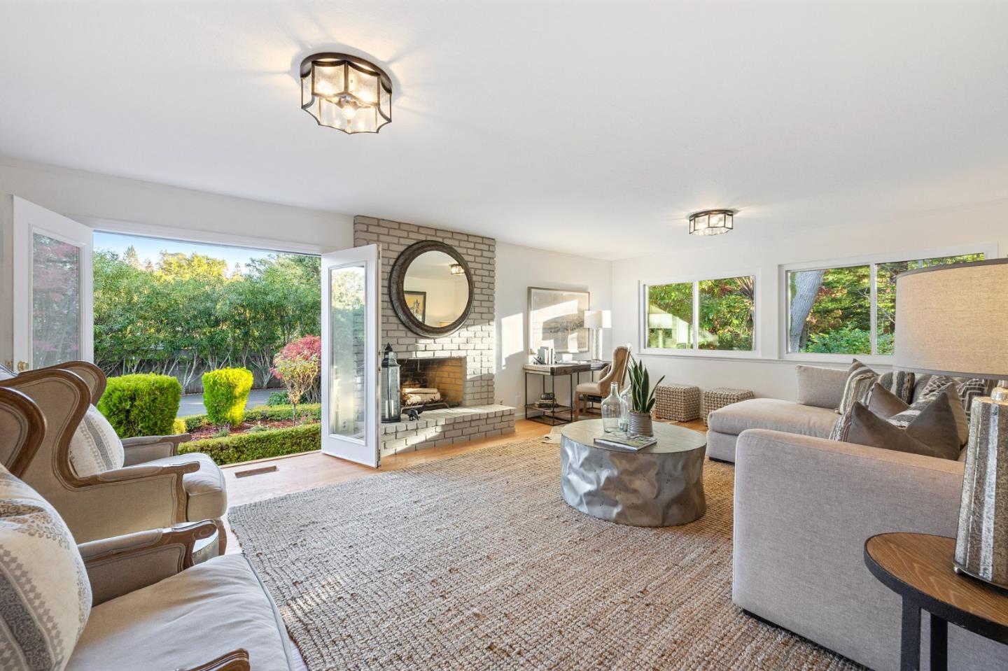 16 Valley Road Atherton, CA 94027 - Photo 40 of 100 a living room with furniture a fireplace and a large window