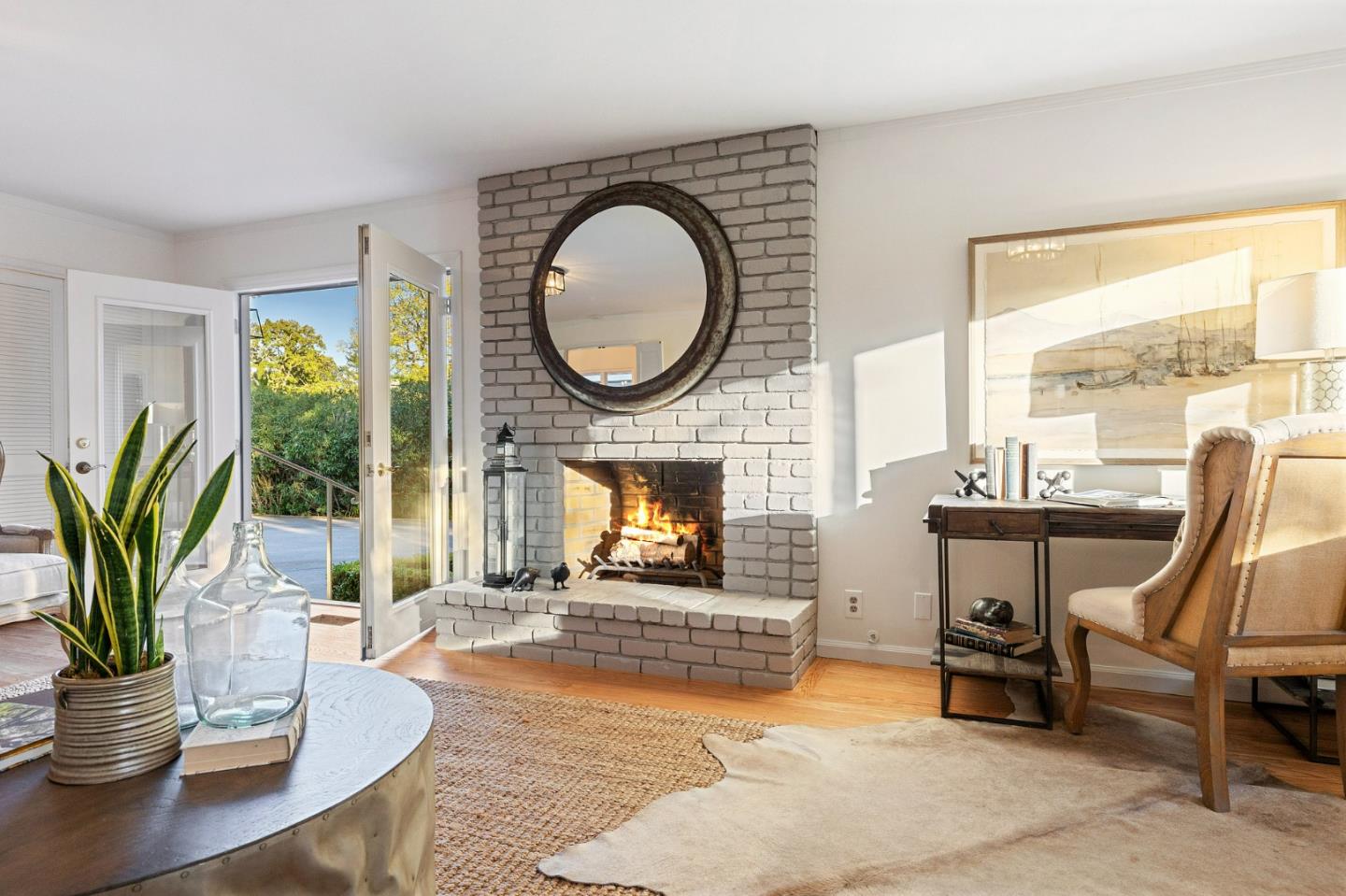 16 Valley Road Atherton, CA 94027 - Photo 44 of 100 a living room with furniture a fireplace a potted plant and a large window