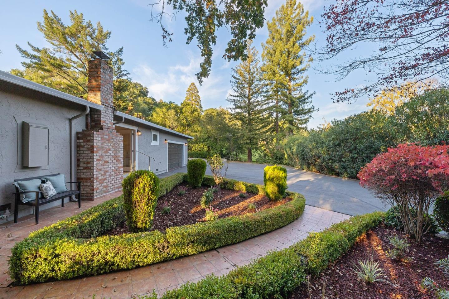 16 Valley Road Atherton, CA 94027 - Photo 47 of 100 a view of a backyard with plants and a patio