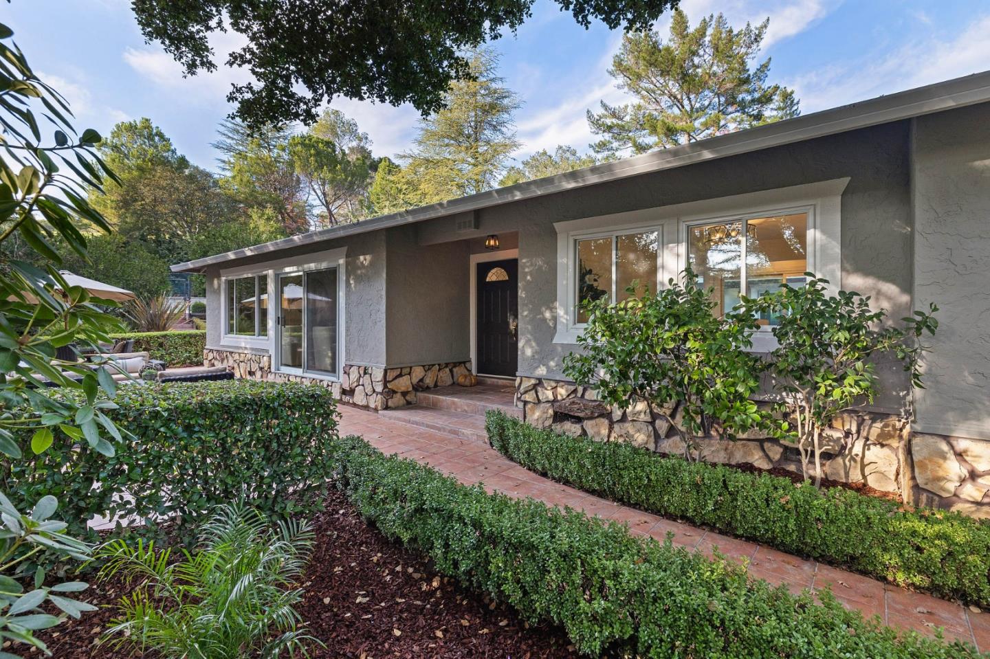 16 Valley Road Atherton, CA 94027 - Photo 5 of 100 a front view of house with a garden