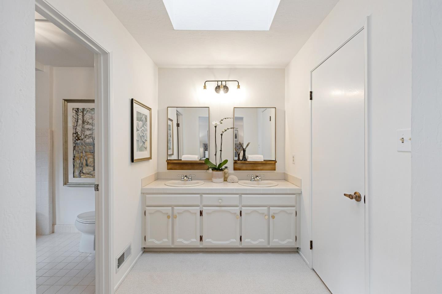 16 Valley Road Atherton, CA 94027 - Photo 54 of 100 a bathroom with a double vanity sink and a mirror