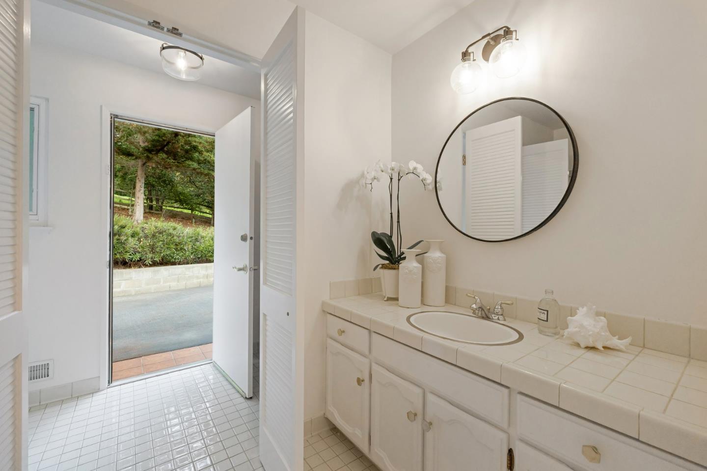 16 Valley Road Atherton, CA 94027 - Photo 63 of 100 a bathroom with a sink and a mirror
