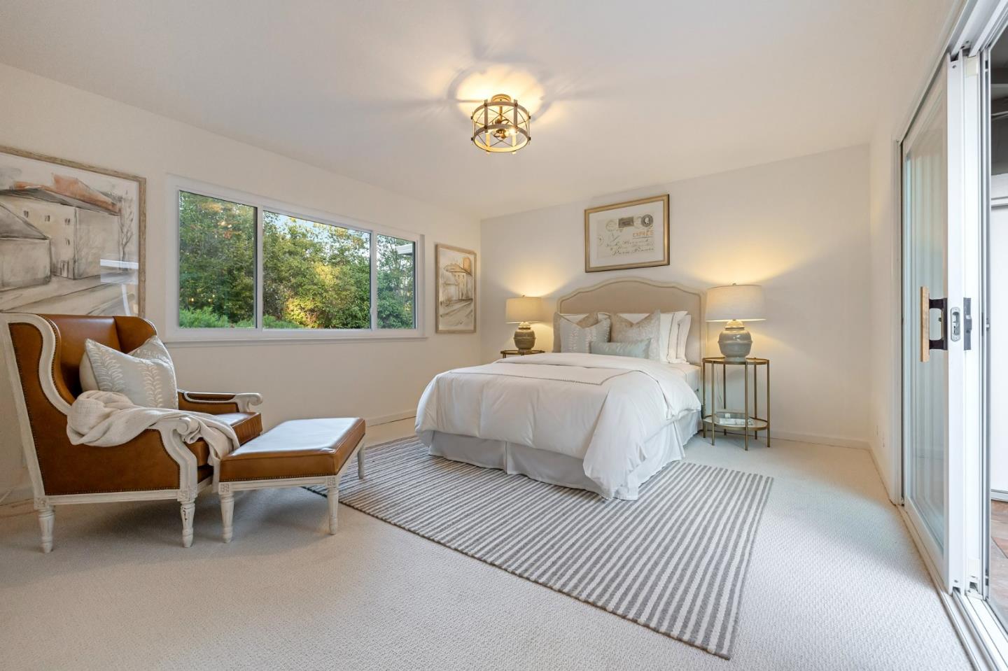 16 Valley Road Atherton, CA 94027 - Photo 67 of 100 a bedroom with a bed and a chandelier