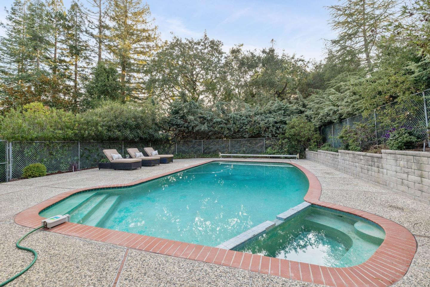 16 Valley Road Atherton, CA 94027 - Photo 70 of 100 a view of a swimming pool with a yard