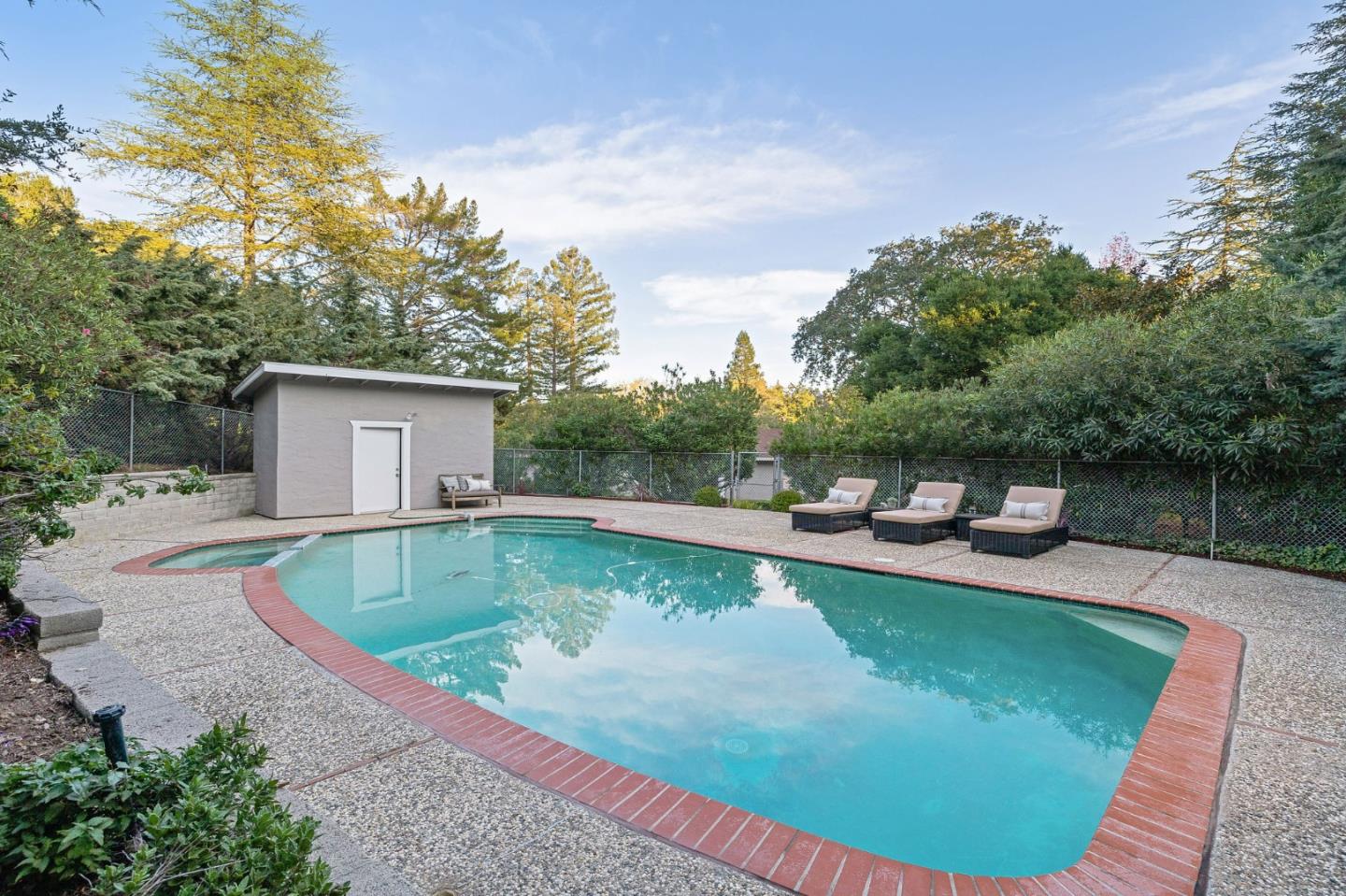16 Valley Road Atherton, CA 94027 - Photo 71 of 100 a view of a swimming pool with a patio