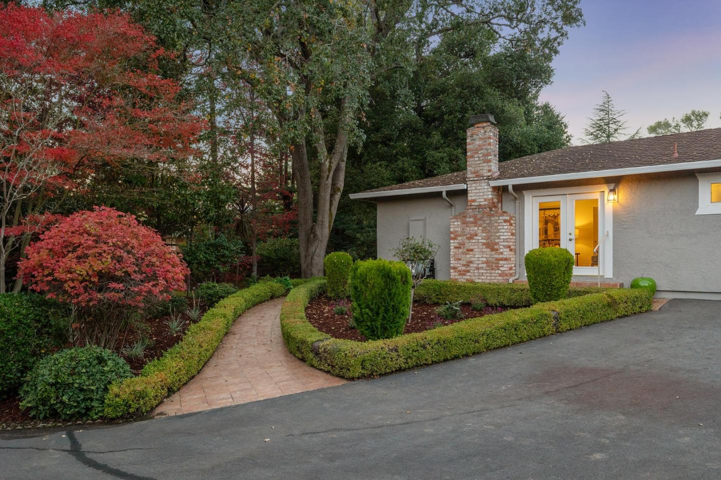 16 Valley Road Atherton, CA 94027 - Photo 91 of 100 a front view of a house with a yard and garage