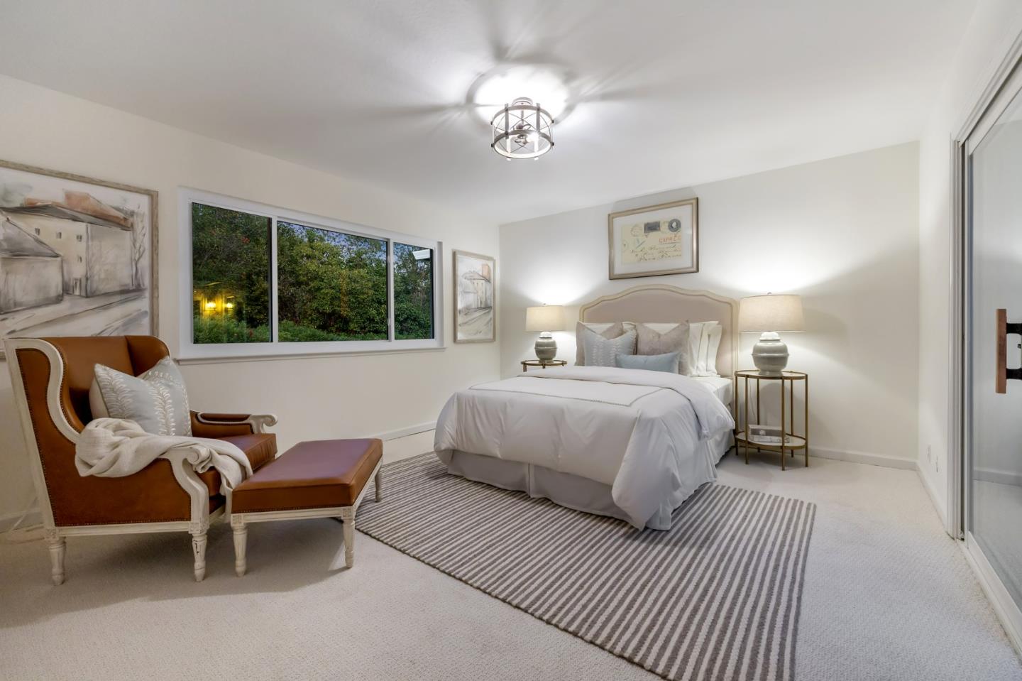 16 Valley Road Atherton, CA 94027 - Photo 94 of 100 a bedroom with a bed and a chandelier