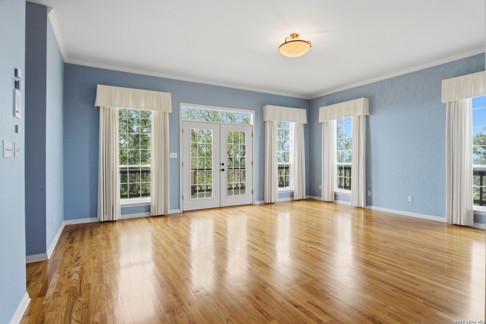26 Seewald Road Boerne, TX 78006 - Photo 24 of 33 a view of an empty room with wooden floor and a window