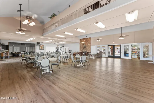 a picture of a room with a white wall and white refrigerator