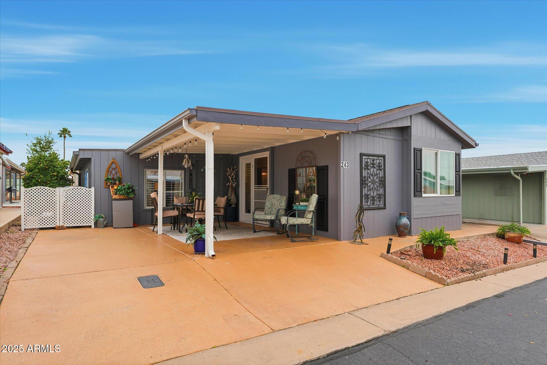 5735 East McDowell Road, Unit 243 Mesa, AZ 85215 - Photo 2 of 42 a view of a house with patio