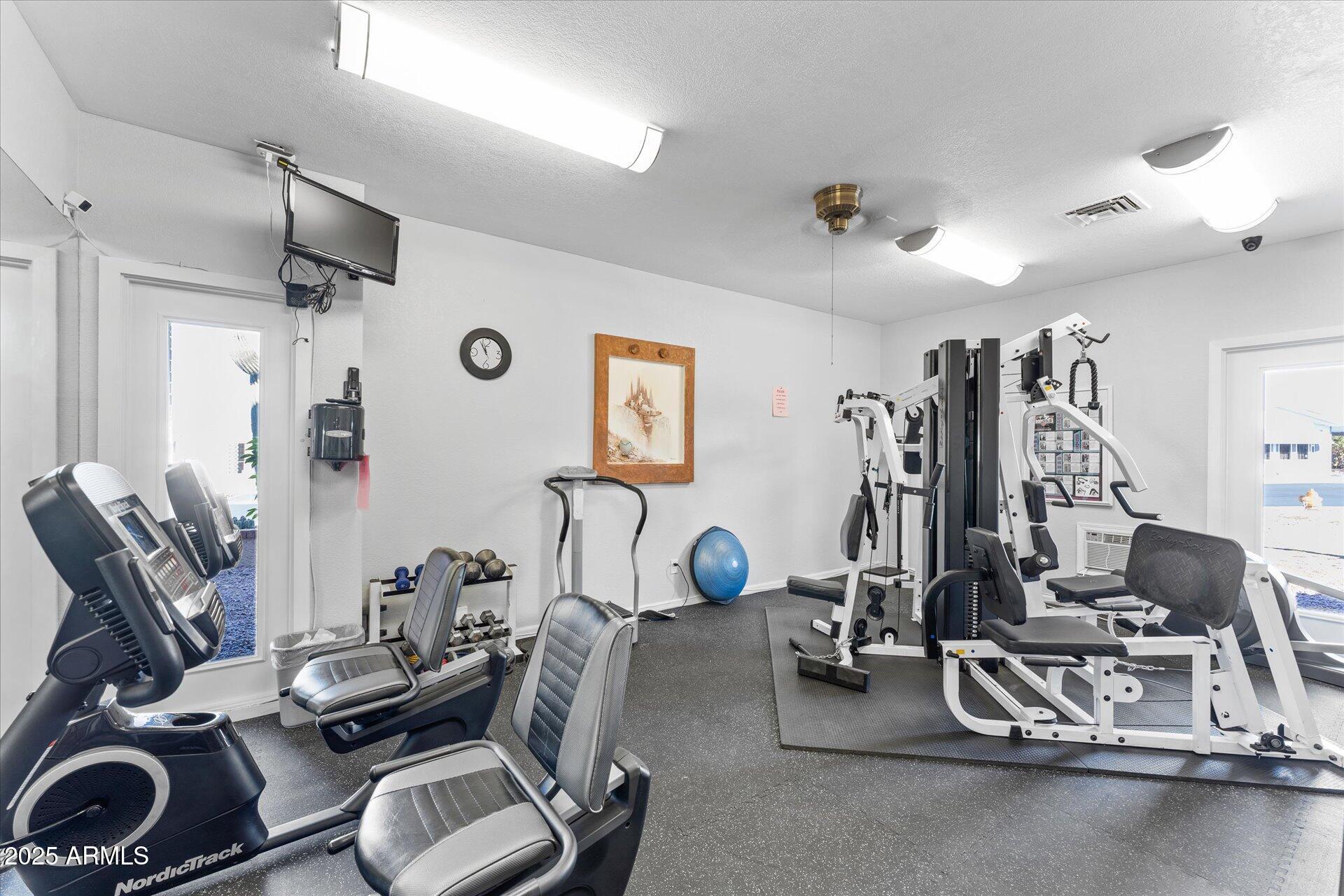 5735 East McDowell Road, Unit 243 Mesa, AZ 85215 - Photo 28 of 42 a view of a room with gym equipment