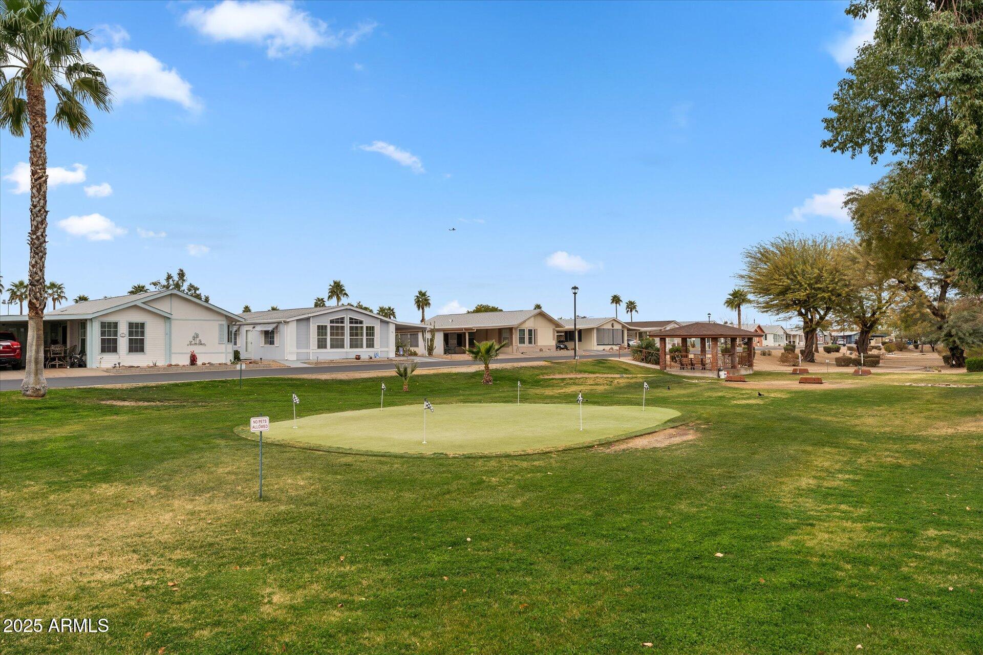 5735 East McDowell Road, Unit 243 Mesa, AZ 85215 - Photo 35 of 42 a view of house with a big yard
