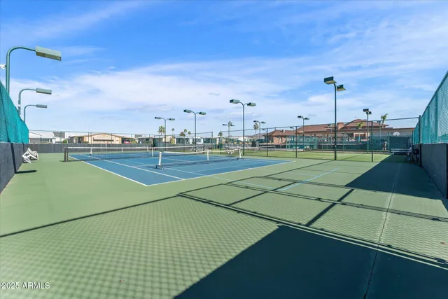 a view of an outdoor space and tennis court