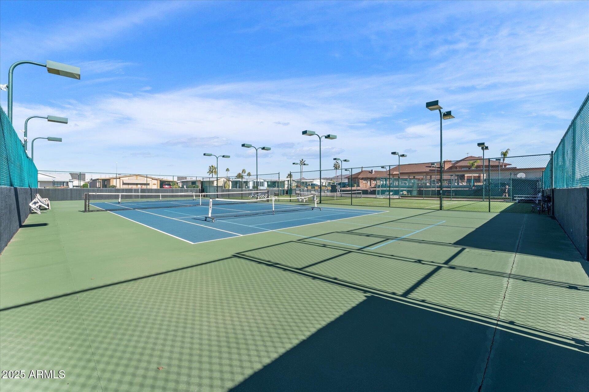 5735 East McDowell Road, Unit 243 Mesa, AZ 85215 - Photo 37 of 42 a view of an outdoor space and tennis court