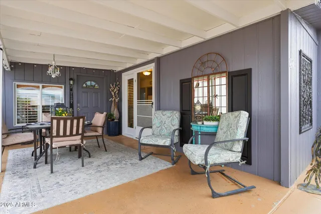 a picture of a room with a white wall and white refrigerator
