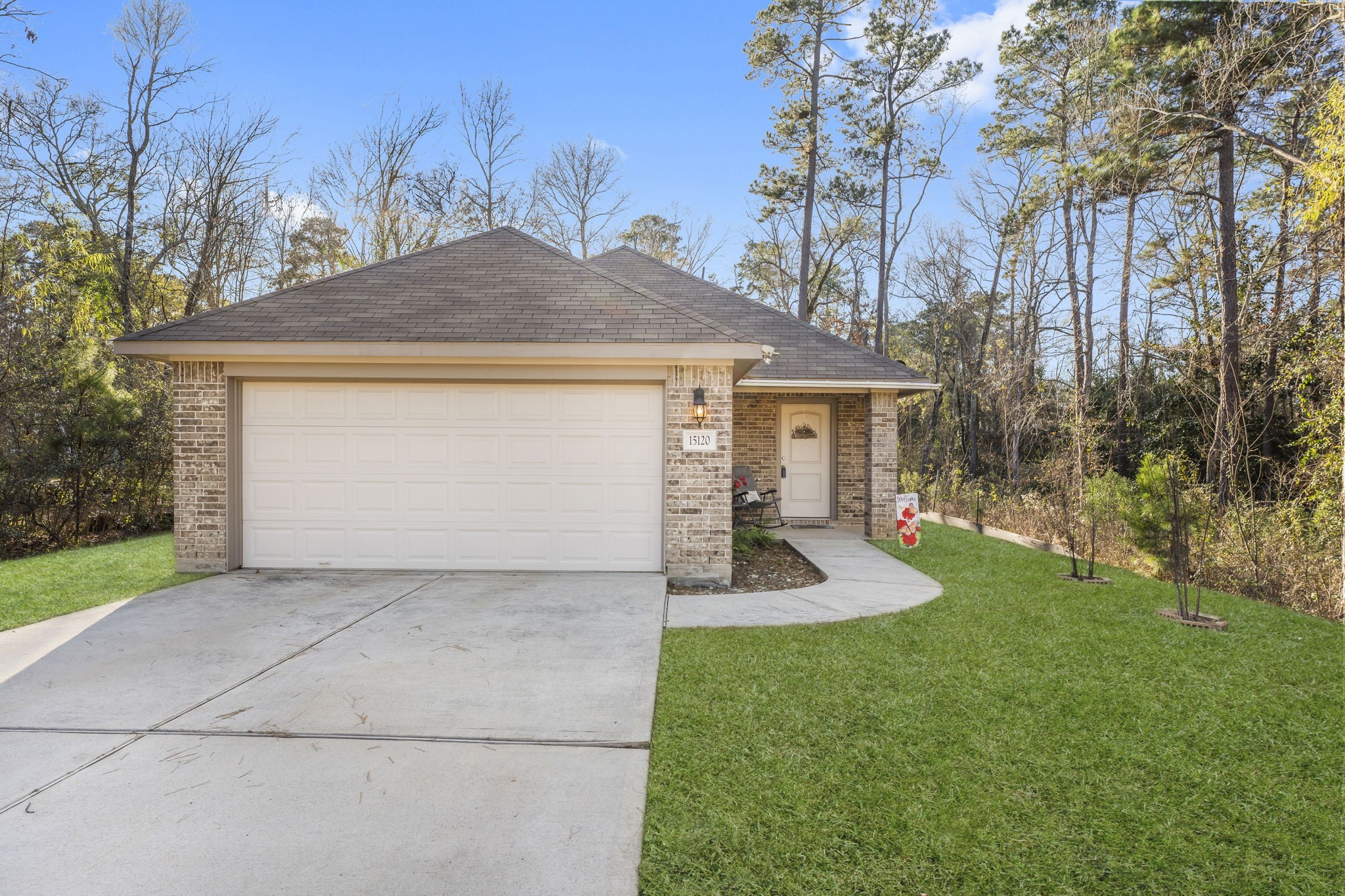 a front view of a house with garden
