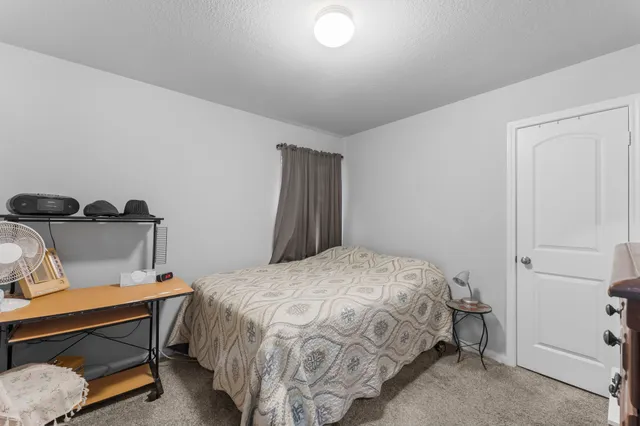 a bathroom with a toilet a sink and a mirror