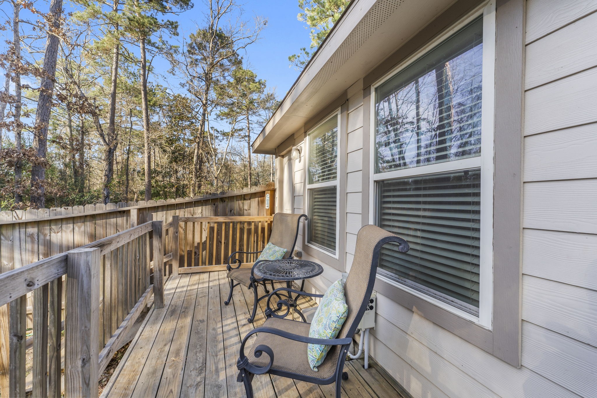 15120 Arrowhead Loop East Willis, TX 77378 - Photo 15 of 22 a view of a chair and table in the balcony
