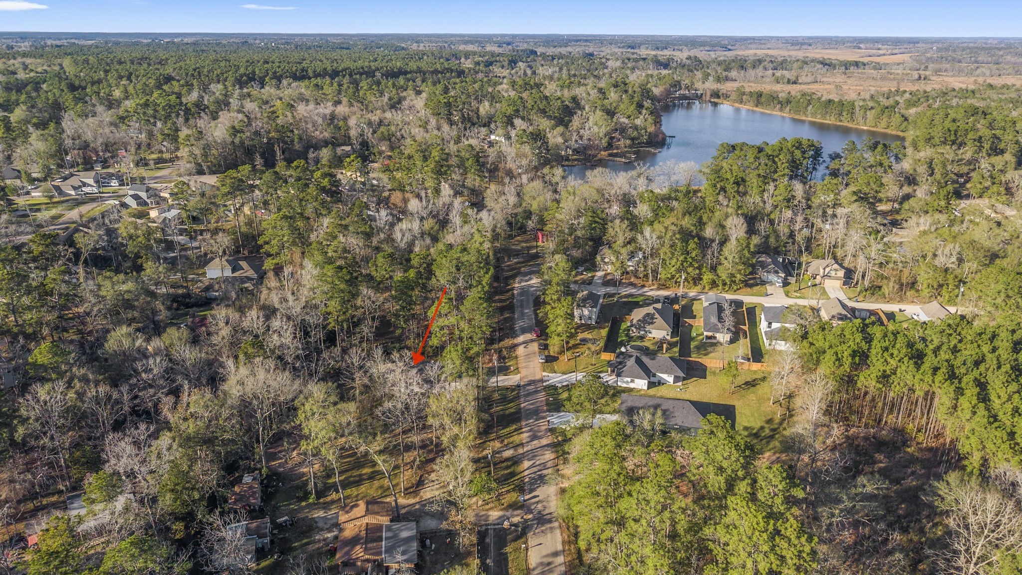15120 Arrowhead Loop East Willis, TX 77378 - Photo 21 of 22 an aerial view of residential houses with outdoor space and trees