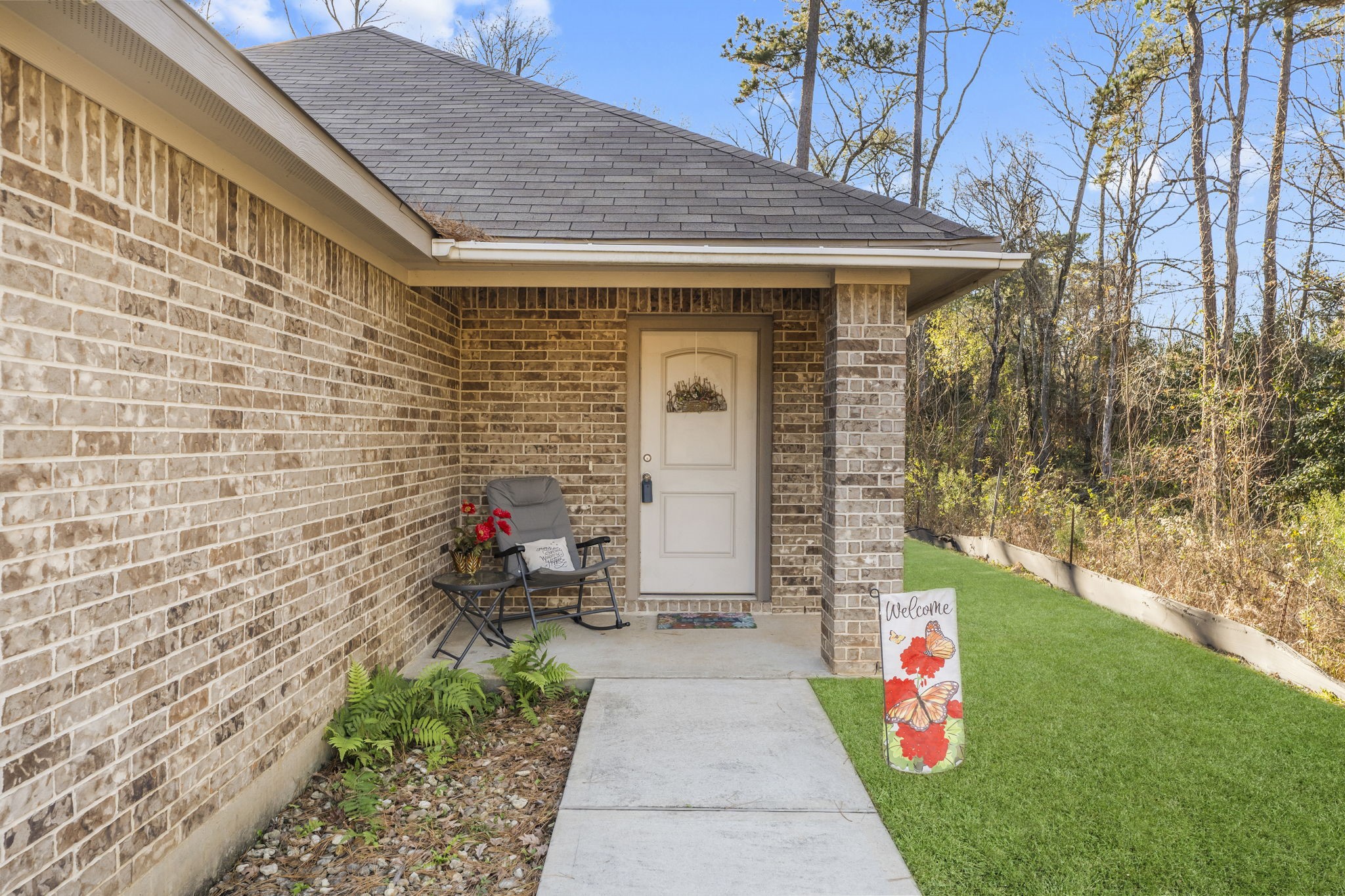 15120 Arrowhead Loop East Willis, TX 77378 - Photo 3 of 22 a front view of a house with a porch