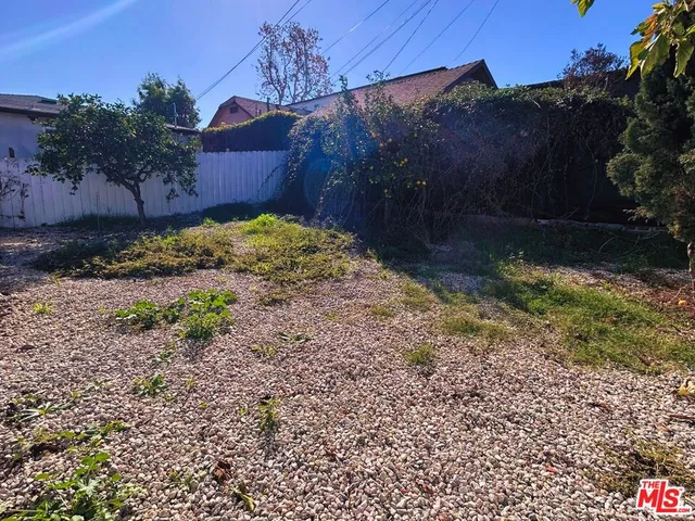 a view of backyard with green space