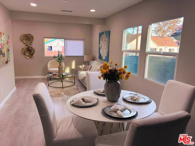 a view of a dining room with furniture window and outside view