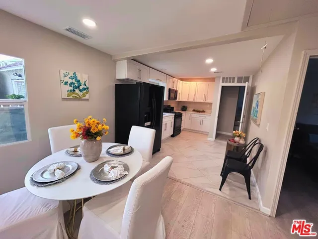 a view of a dining room with furniture