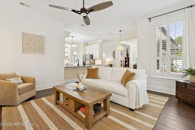 a kitchen with stainless steel appliances granite countertop a stove a sink and white cabinets