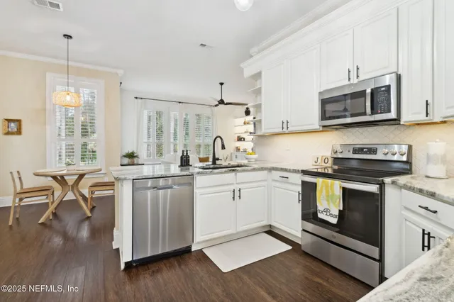 a workspace with furniture bookshelf and a window