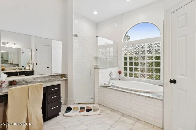 a living room with furniture and a book shelf