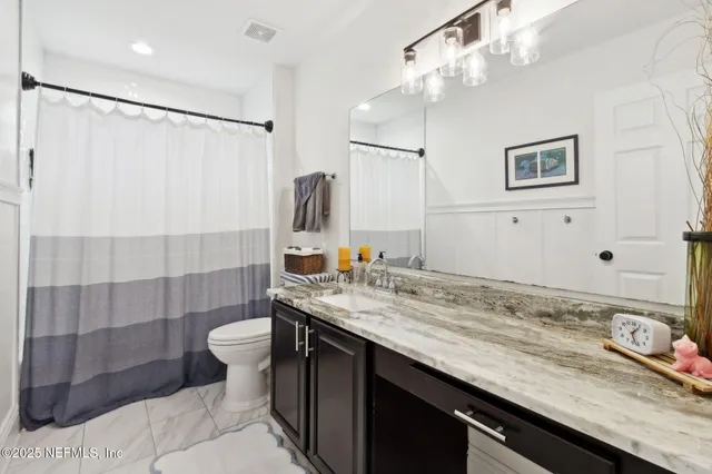 a front view of a house with a yard outdoor seating and garage